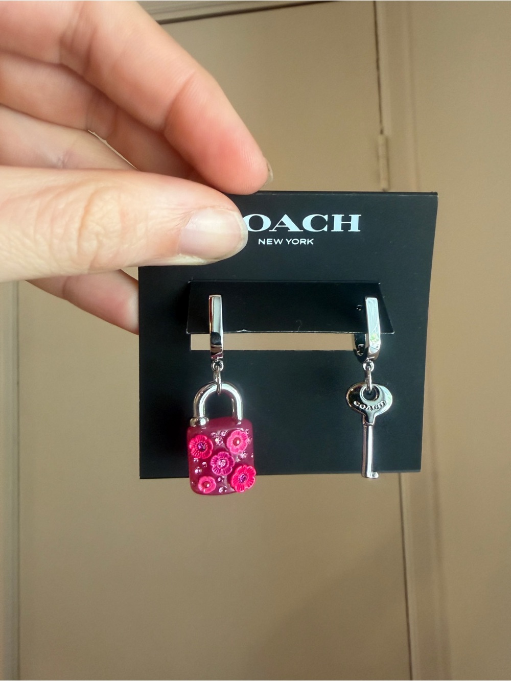 Coach pink floral lock and key huggie earrings